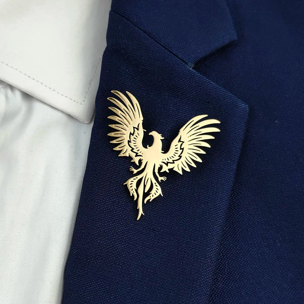 Gold phoenix brooch on a navy blazer