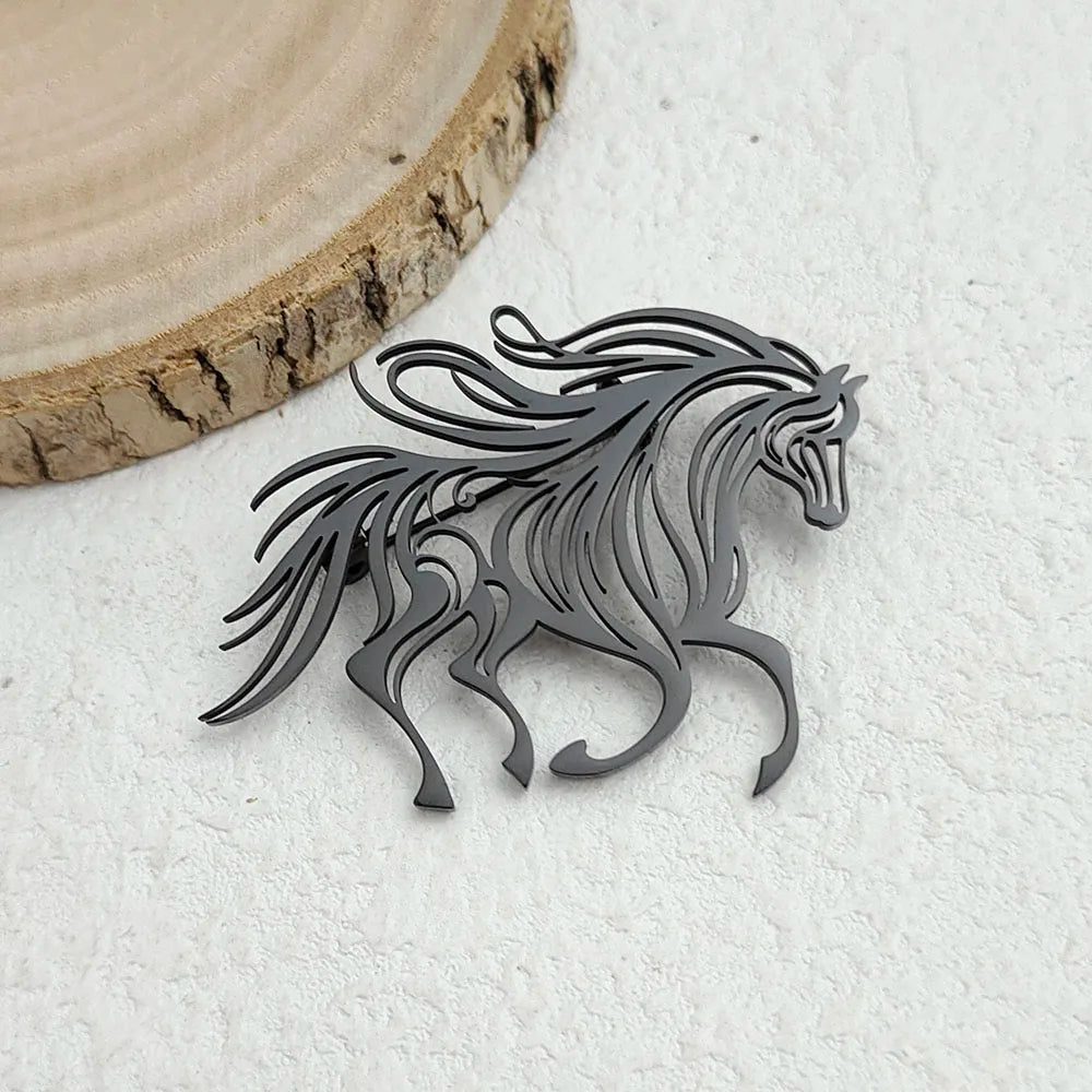 Metallic horse-shaped object on a textured white surface with a wooden circular piece.