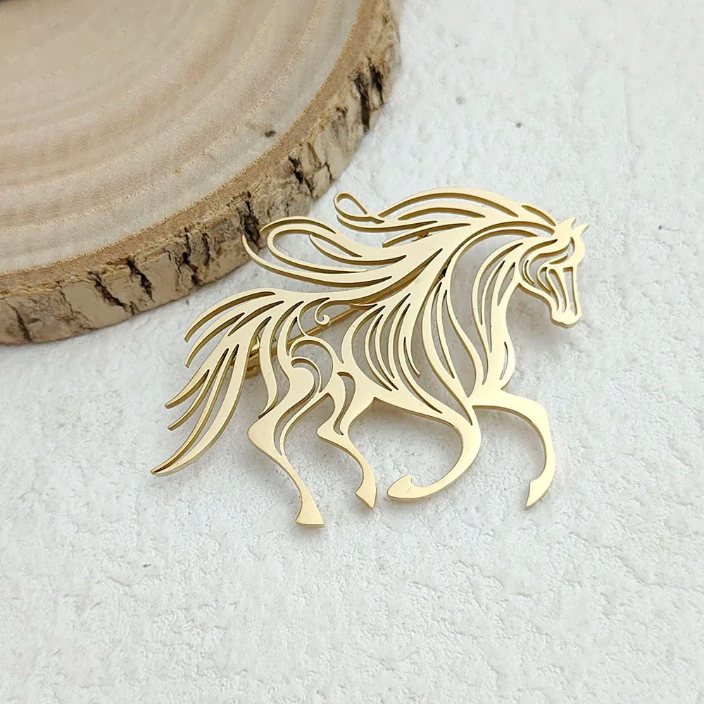 Gold horse-shaped decorative item on a light background