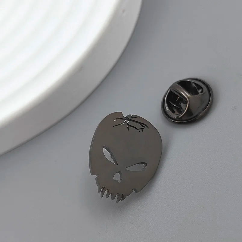 Skull and Tooth Lapel Pin